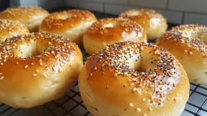 freshly baked sourdough bagels, golden brown with sesame or everything bagel toppings, right at the beginning of the article.