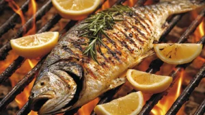 Whole branzino grilling over flames with charred skin, lemon wedges, and fresh rosemary on the side.